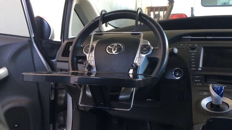 A Steering Wheel Desk Attached To A Steering Wheel