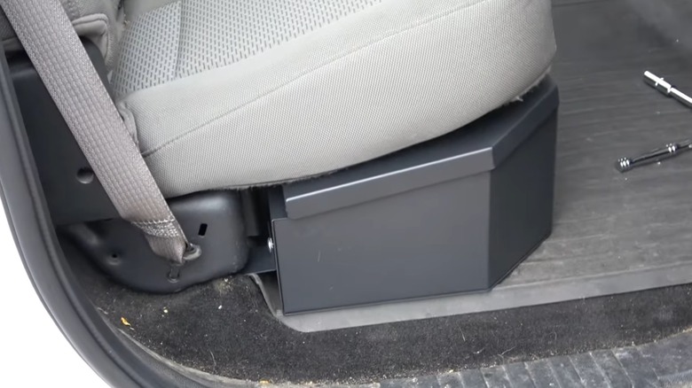 An Under Seat Lockable Storage Container Installed