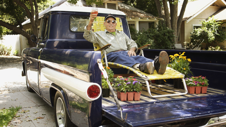 Man lounging in truck bed