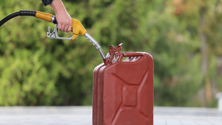 Person filling up gas canister