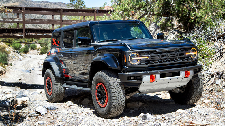 Ford Bronco Raptor off-roading in woods