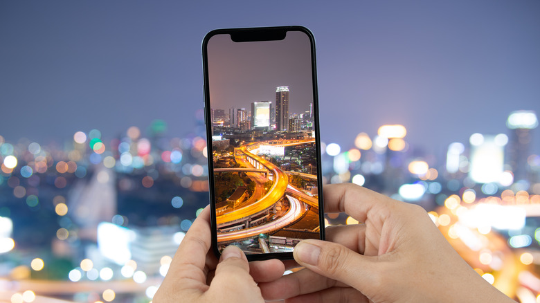 Image of an iPhone clicking a city landscape