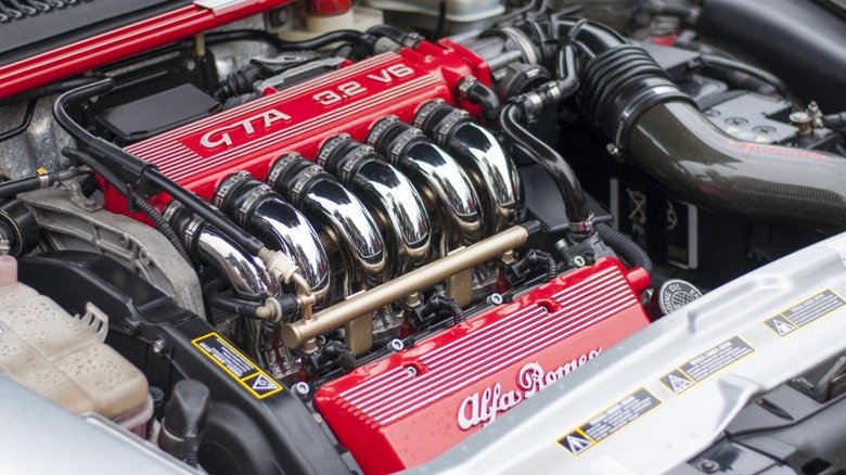 3.2-liter Alfa Romeo Busso V6 in an engine bay with red paint