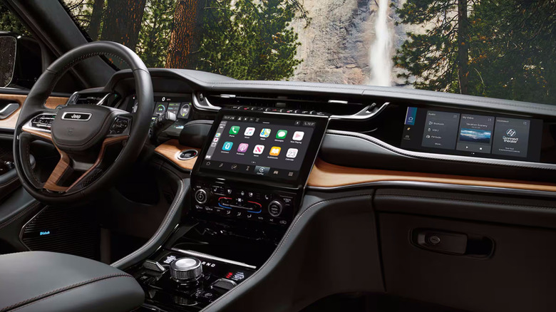 Interior of Jeep Grand Cherokee with infotainment screen and digital dashboard