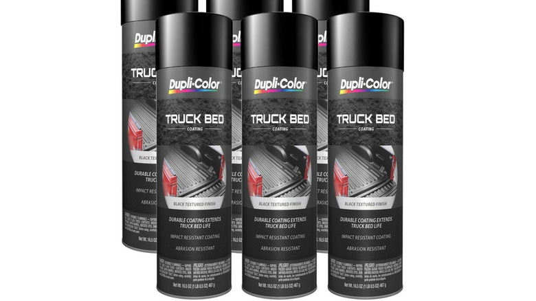 six cans of dupli-color truck bed coating against white background