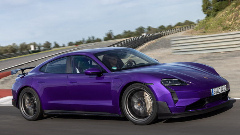 Front 3/4 view of Porsche Taycan Turbo GT driving on track