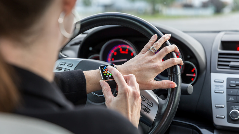 woman using apple watch