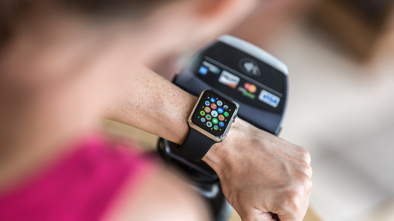 woman looking at Apple watch