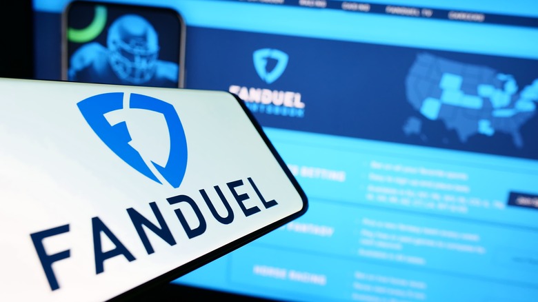 Smartphone laptop fanduel logos