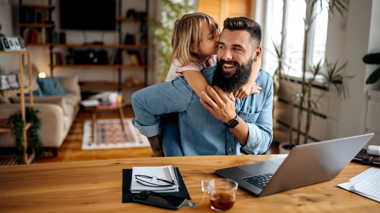 man and girl in living room