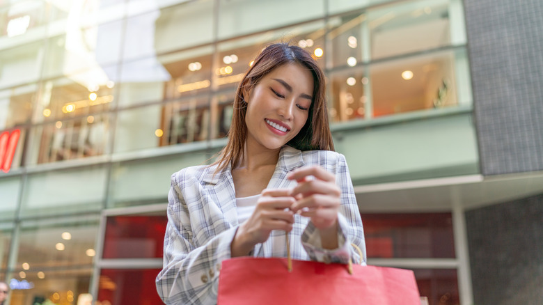 woman holding shopping bags