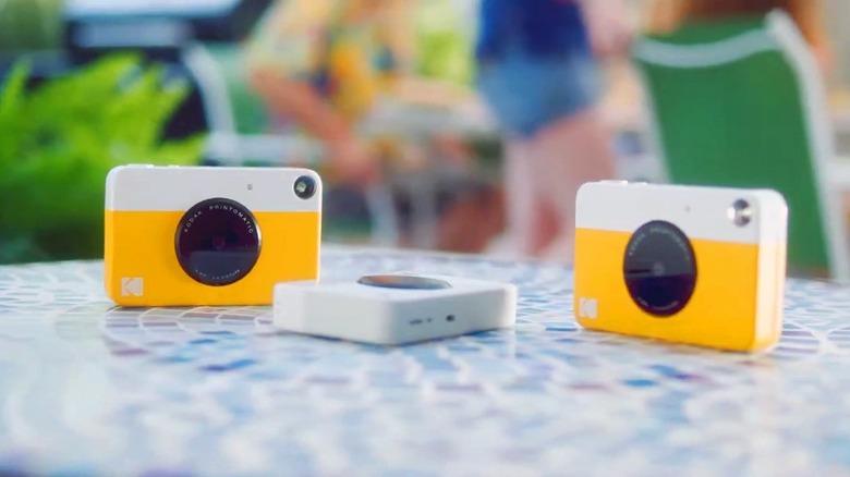 Kodak Printomatic cameras on table