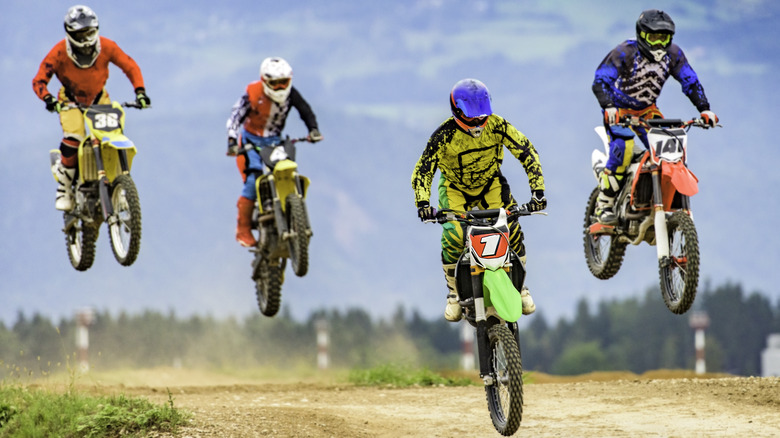 four dirt bikers