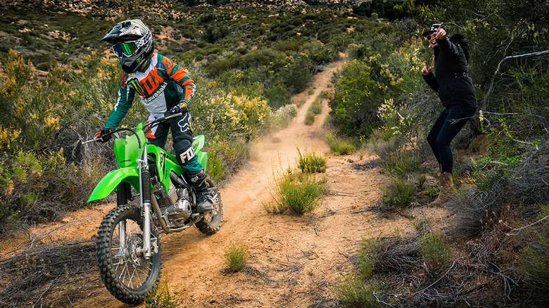 person riding klx 140r bike