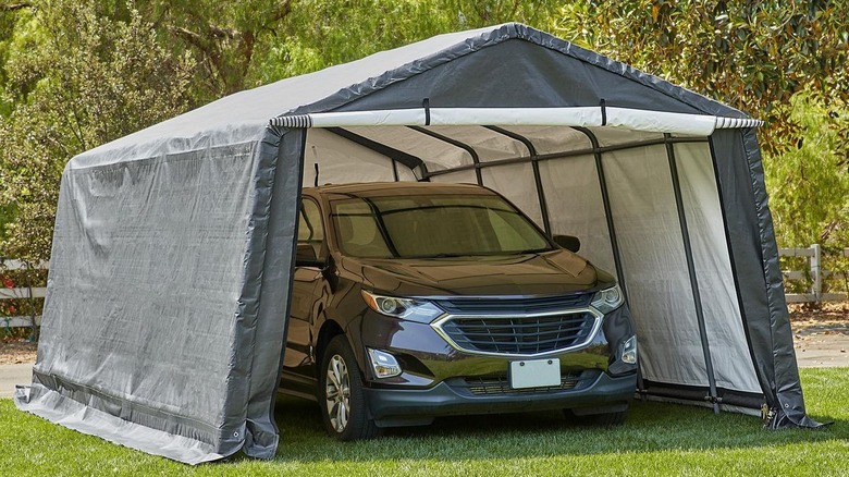 CoverPro portable garage set up over a sport utility vehicle