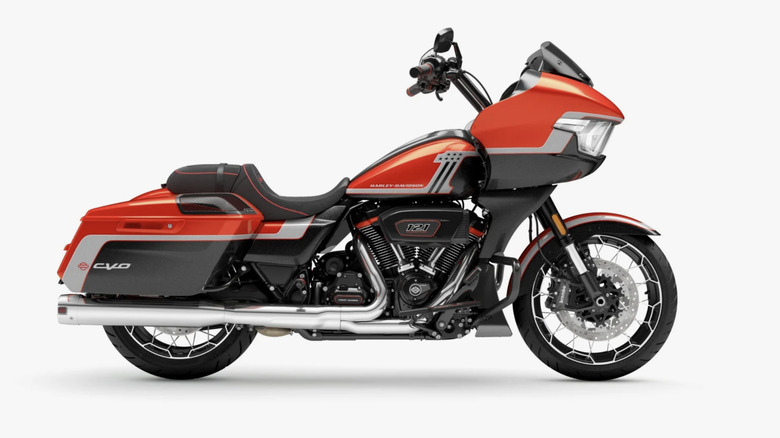 Orange Harley CVO Road Glide parked against white background