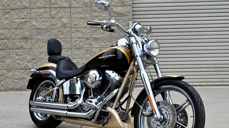 2003 Harley-Davidson Softail Deuce parked in front of tan wall and garage door