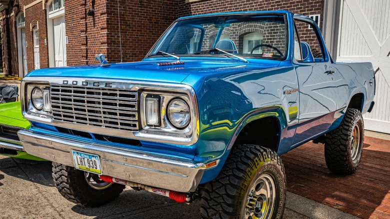 a blue 1974 Dodge Ramcharger with its top down