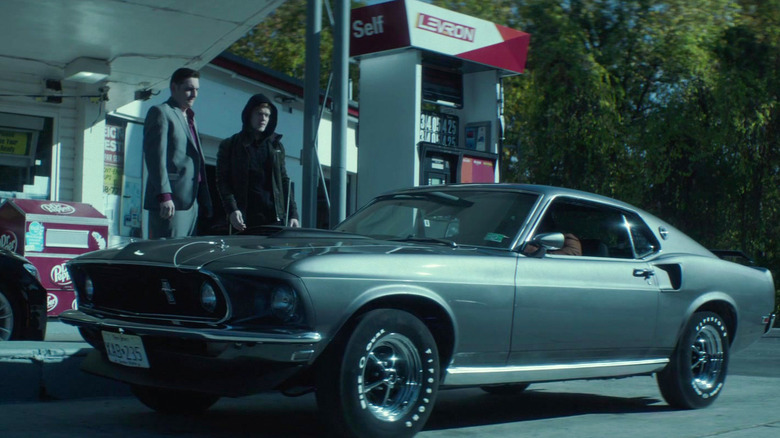 1969 Ford Mustang Mach 1 parked at gas pump