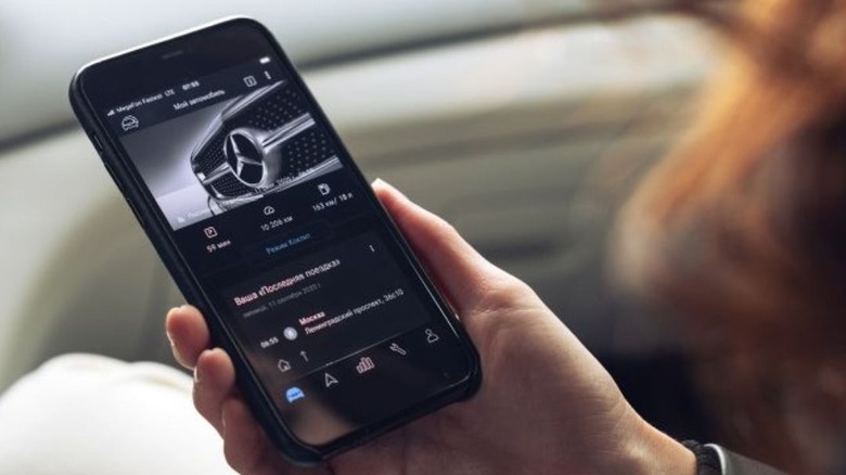 Holding phone with Mercedes app