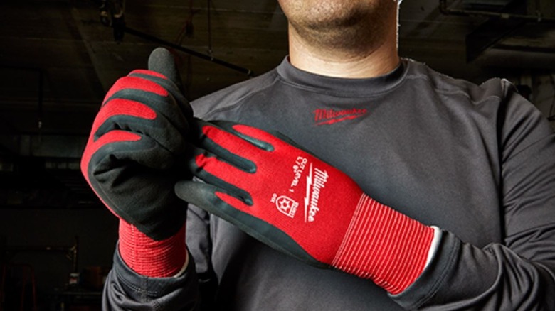 person wearing Milwaukee insulated gloves