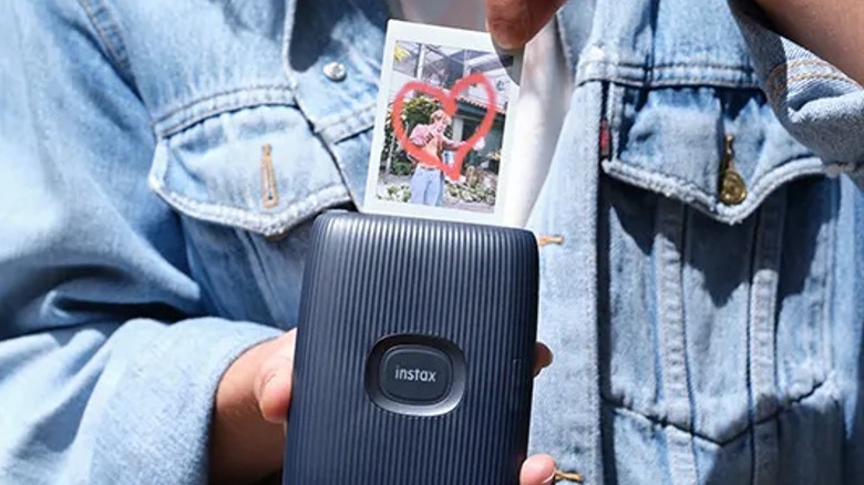 Person holding Fujifilm Instax Mini Link 2 