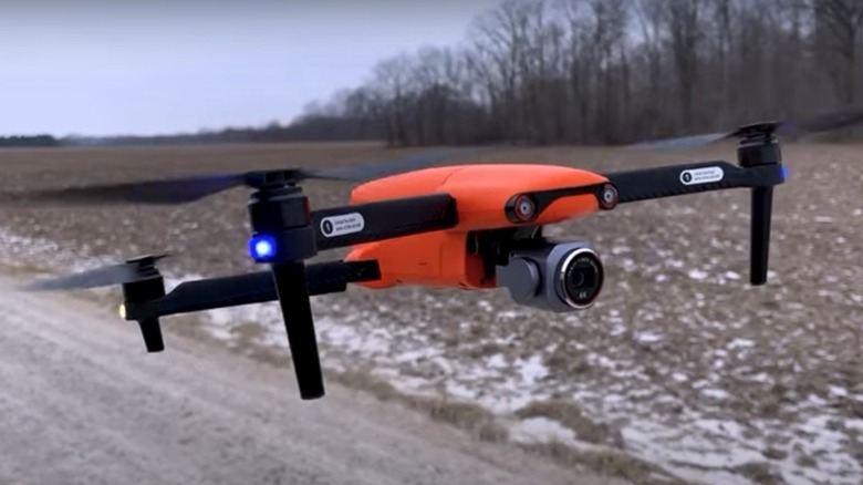 Flying an Autel Robotics Evo Lite+ drone along a snowy road