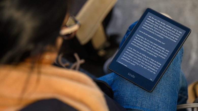 woman reading on Kindle