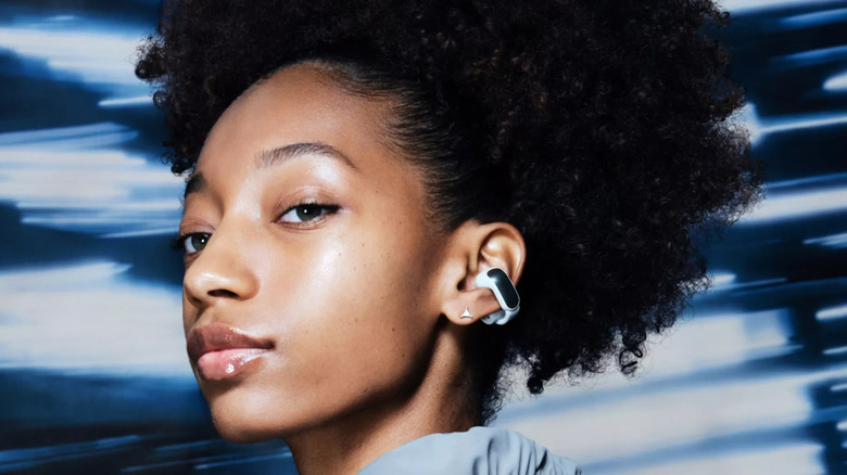 girl wearing bose ultra open earbuds