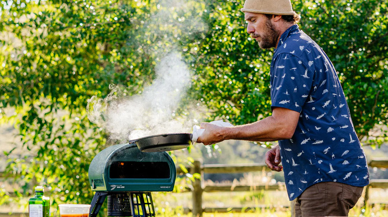 Man with Pizza Oven outdoors