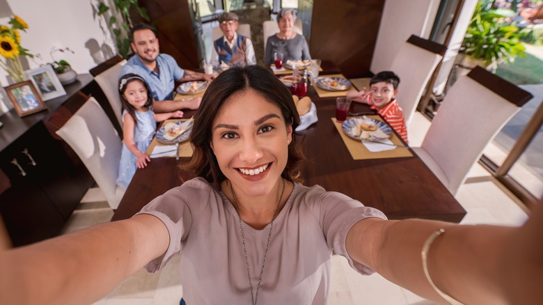 Woman capturing a group selfie