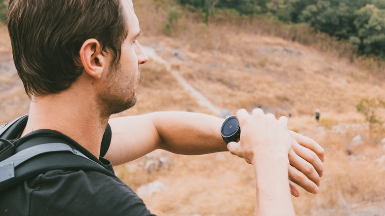 Person using a smartwatch for navigation