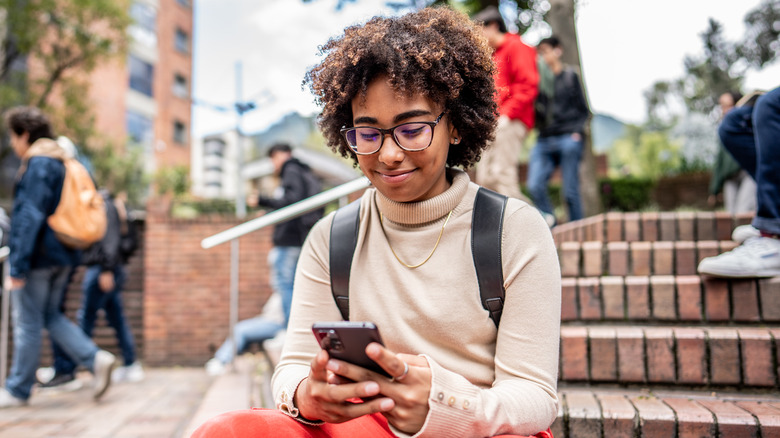 Young woman looking at phone