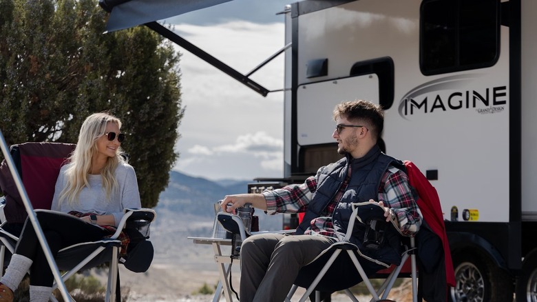 a couple outside a trailer