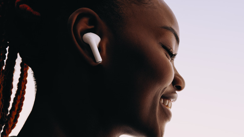 woman wearing Apple Airpods