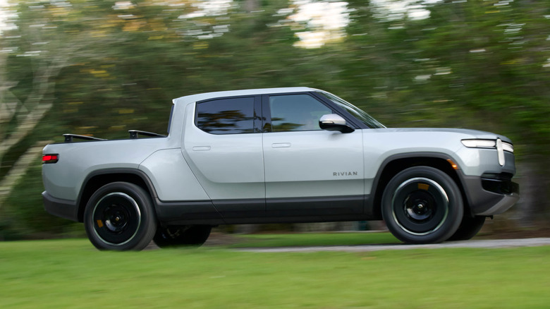 Silver Rivian R1T accelerating