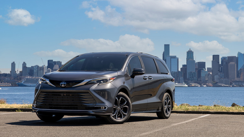 2025 Toyota Sienna Platinum parked in front of water and city skyline