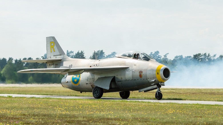 Saab 29 jet plane taxing on a runway