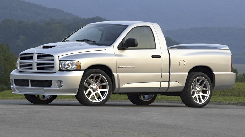 Silver 2004 Dodge Ram SRT-10 parked on a pavement with mountains in the background