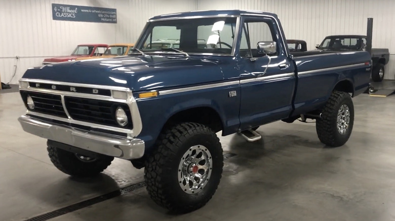 A restored 1973 Ford F-250 "Highboy" truck on display