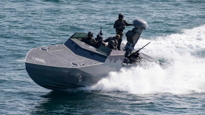 A special ops crew rides in the Combatant Craft Assault boat