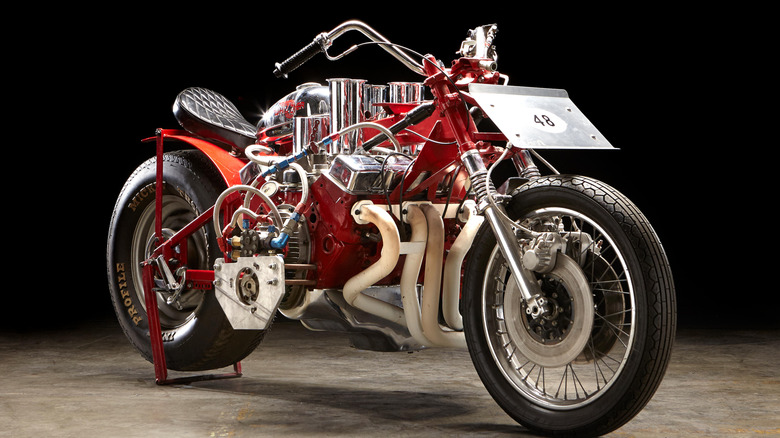 EJ Potter's Widowmaker 7 drag racing motorcycle on cement floor with black background