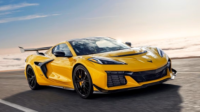 Yellow 2025 Chevrolet Corvette ZR1 parked on a road with sky background