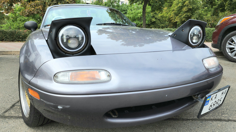 Miata pop up headlights closeup