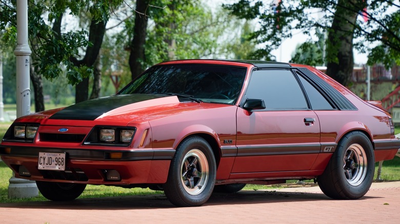 A red 1985 Ford Mustang GT