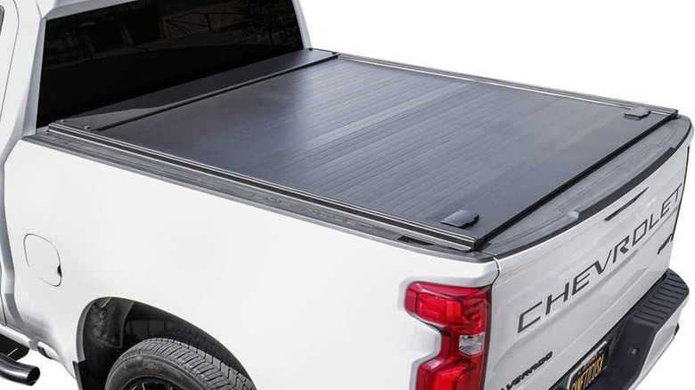 Syneticusa MB retractable truck bed cover on a Chevy Silverado.