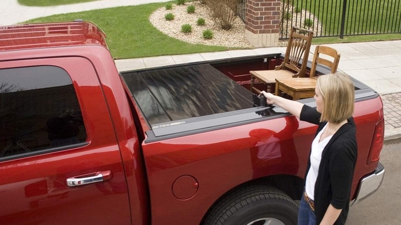 Using a retractable truck bed cover with tall chairs in the back.