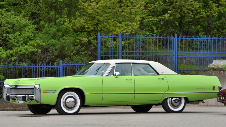 Green Chrysler Imperial LeBaron parked in lot