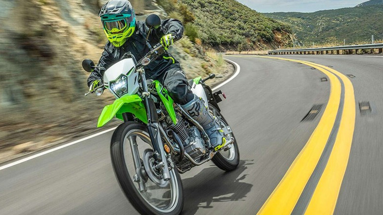 person riding kawasaki klx 230