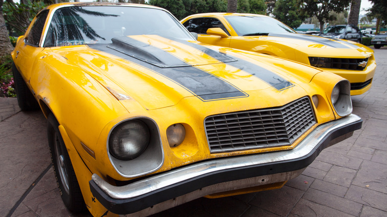 1977 Chevy Camaro alongside 2006 Camaro